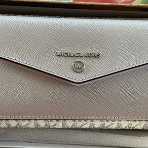 Brand new Michael Kors Wrislet pocket wallet in silver